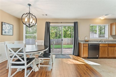 Dining room with new stylish light fixture, open t