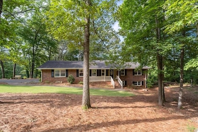 Single story, four sided brick home.