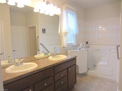 Master bath with double sinks and 2016 added walk-