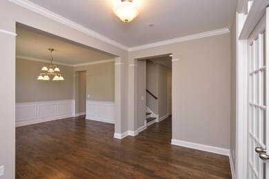 Elegant formal dining opens to butler's pantry