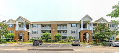 View of front of home with uncovered parking