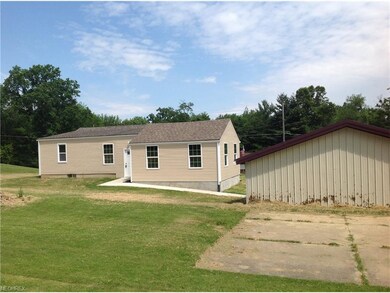 back view with large patio area or room to add she