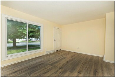 Spare room with plenty of natural light and light 