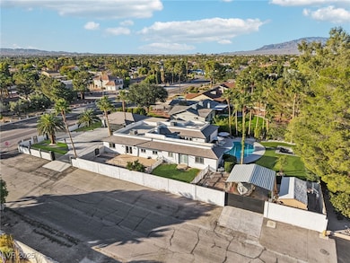 Aerial view of residential area featuring a mountain backdrop