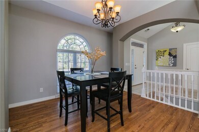 Formal dining with wood floors.