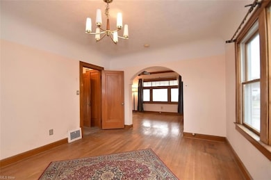 Dining room with view of the living room and entrance to the kitchen.