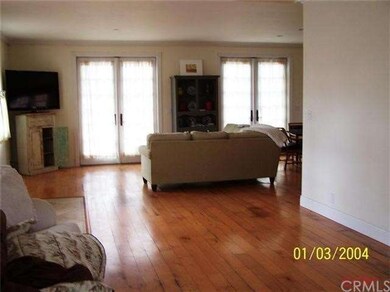 Wood floors and natural light grace the roomy gues
