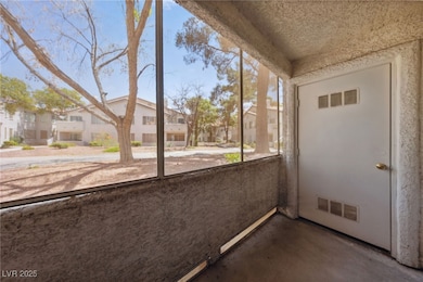 Unfurnished sunroom featuring a residential view