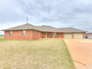 Ranch-style home with a garage and a front yard