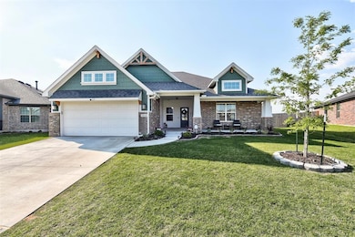 Craftsman-style house with a front yard