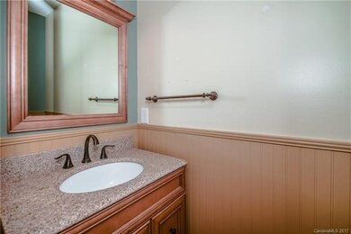 Powder Room with upgraded vanity, mirror and wains
