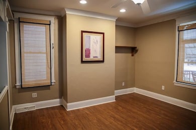 Spacious living room with ceiling fans and recesse
