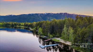 Mountain view featuring a forest and a nearby body of water