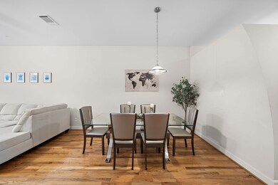 The dining area with seating for six sets an elega