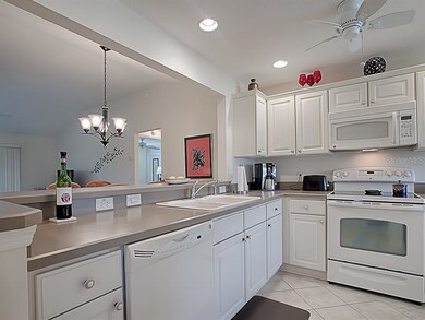 Fresh white cabinetry and appliances in the open k