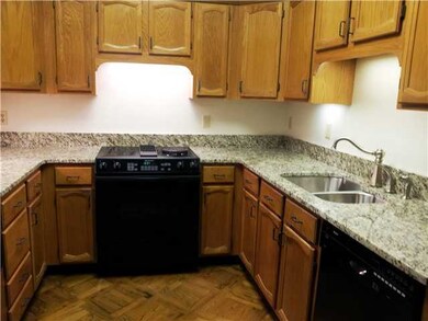 KITCHEN WITH NEW GRANITE COUNTERTOPS AND SUBZERO F