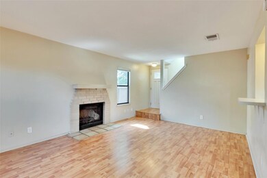Unfurnished living room featuring wood finished f