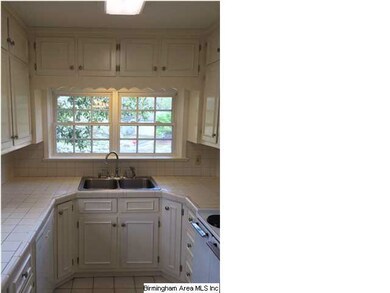 This bright and airy kitchen features TONS of stor