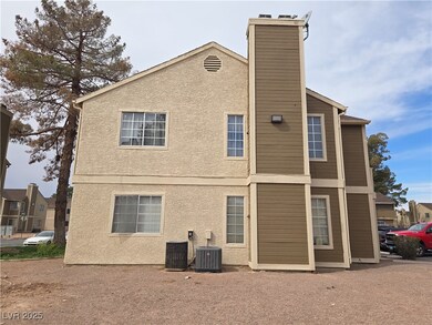 Back of house with cooling unit, a chimney, and st