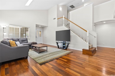 This bright and airy living room features high cei