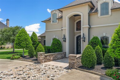 Front of house has a widen driveway with custom ha