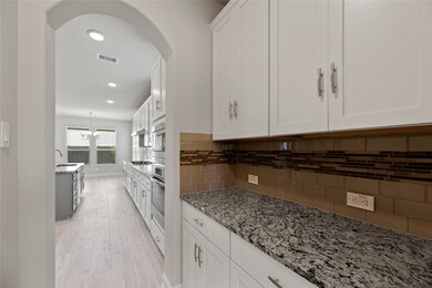 A butler's pantry is the ideal feature for hosting and entertaining. Easy access to the kitchen and dining area enables you to keep your guests satisfied. After all, it's always 5:00 somewhere.
