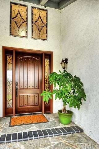 Flagstone Walkway Leads to Custom Entry Door with 