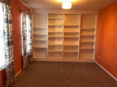 Open office space off the foyer in the front of the home.  All the shelves are adjustable.