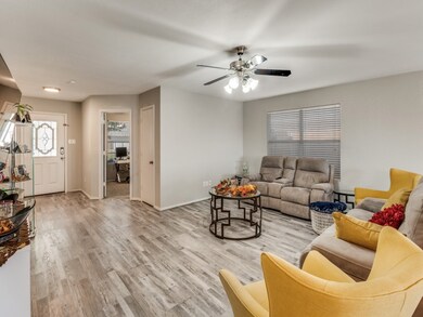 Living room featuring light wood-style floors and ceiling fan