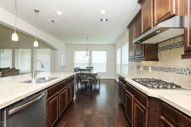 This kitchen is complete with everything you need to prep the weeks meals with plenty of counter space and a walk-in pantry.