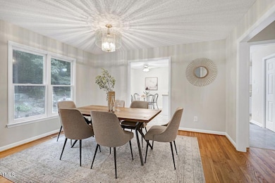 Dining room has a cool light fixture.