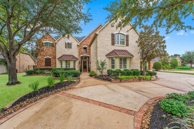 STUNNING EXTERIOR - Stroll up the circle drive to truly appreciate the Custom Architectural Detail beginning with the many Gables, multi-dimensional façade, Rich Stone and Brick Masonry, Timeless  Arched Roman windows with Keystone accents and Shutters, and Immense Bay Windows with Metal Bonnets. The long walkway to the porch reveals the New Elegant 8’ Mahogany and Iron Door with Side and transom windows.