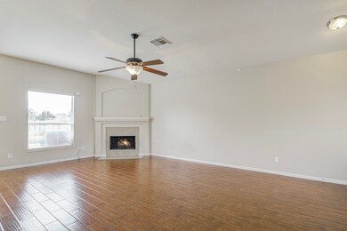 well layed out living area with cozy fireplace