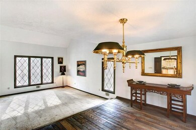 Sunken living room opens to expansive dining room