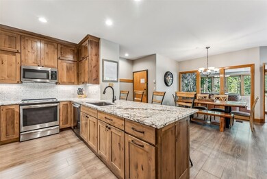Kitchen with sink, hanging light fixtures, light w