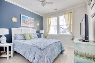 Bedroom featuring light carpet, baseboards, visibl