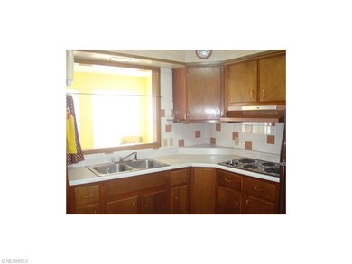 Kitchen has a pass through window to the sun room 