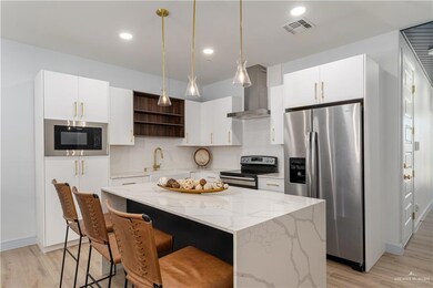 Kitchen featuring Waterfall Island