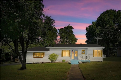 Ranch-style home featuring a front lawn