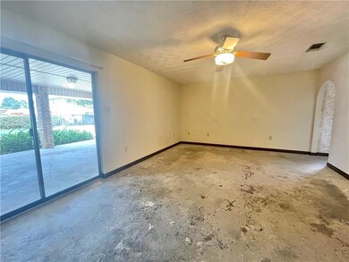 Primary bedroom with sliding glass doors to back p