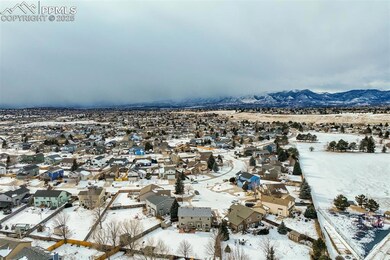 Snowy aerial view with a mountain view
