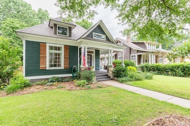 View of front of home featuring a porch and a front lawn