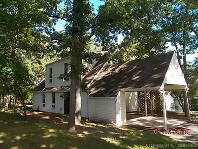 Left side of home with concrete patio