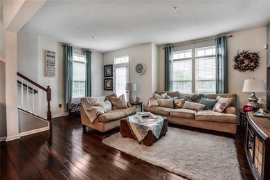 Tons of natural light in living room with access t