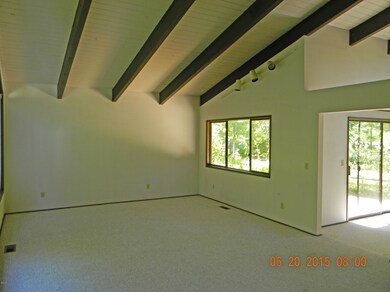 Living room w/vaulted open beam ceiling