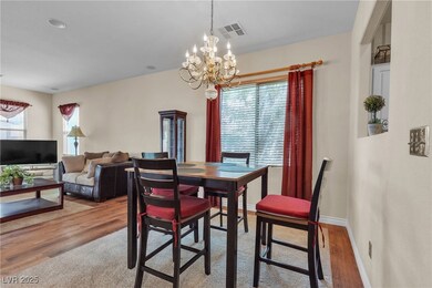 Dining area featuring a chandelier and wood finish
