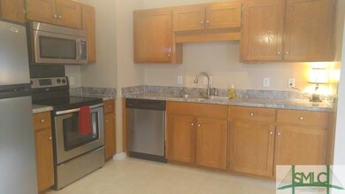 Kitchen features stainless steel appliances and am