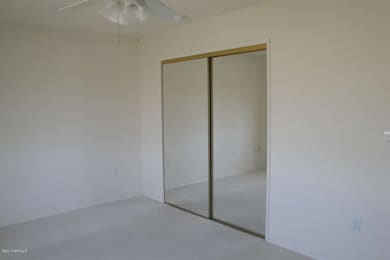 GUEST BEDROOM HAS MIRRORED DOORS