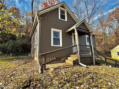 View of front of house featuring stairs