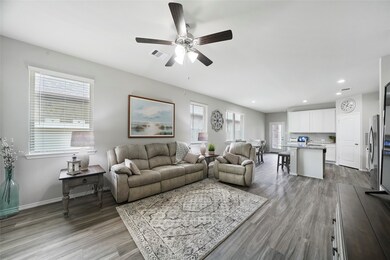 This open floor plan has gorgeous wood look flooring throughout the living area. Light neutral walls and excellent window placement with 2